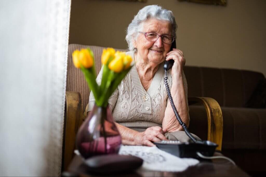 Senior woman talking on the phone to family.