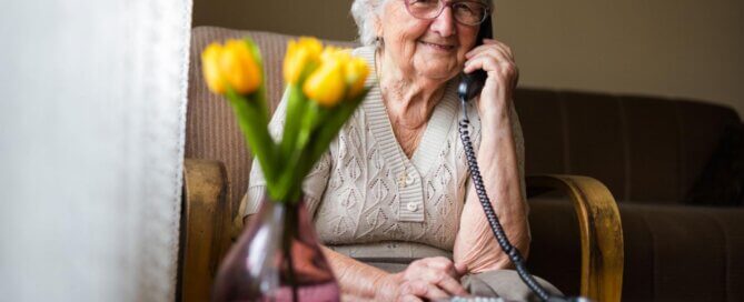 Senior woman talking on the phone to family.
